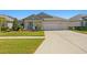 Single-story house with a two-car garage and well-manicured lawn at 13614 Tonya Anne Dr, Riverview, FL 33579
