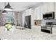 Updated kitchen with granite countertops and stainless steel appliances at 13614 Tonya Anne Dr, Riverview, FL 33579