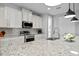 Bright kitchen with white cabinets, granite countertops and stainless steel appliances at 13614 Tonya Anne Dr, Riverview, FL 33579