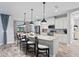 Elegant kitchen featuring white cabinets, granite counters, and stainless steel appliances at 13614 Tonya Anne Dr, Riverview, FL 33579