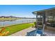 Enjoy this lakefront patio with rocking chairs at 13614 Tonya Anne Dr, Riverview, FL 33579