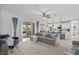 Open concept living room with kitchen and access to backyard patio at 13614 Tonya Anne Dr, Riverview, FL 33579