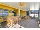 Covered patio with wicker furniture, bar, and lake view at 13614 Tonya Anne Dr, Riverview, FL 33579