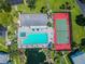 Overhead view of community pool and tennis courts at 1433 Pine Glen Pl # D1, Tarpon Springs, FL 34688