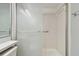 Bathroom with shower and tiled walls at 1433 Pine Glen Pl # D1, Tarpon Springs, FL 34688