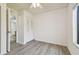 Bedroom with grey flooring and bathroom access at 1433 Pine Glen Pl # D1, Tarpon Springs, FL 34688