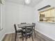 Bright dining area with table and four chairs, open to kitchen at 1433 Pine Glen Pl # D1, Tarpon Springs, FL 34688