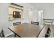 Bright dining area with table and four chairs, open to kitchen at 1433 Pine Glen Pl # D1, Tarpon Springs, FL 34688