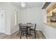 Bright dining area with table and four chairs, open to kitchen at 1433 Pine Glen Pl # D1, Tarpon Springs, FL 34688