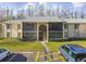 Front view of condo building and entrance at 1433 Pine Glen Pl # D1, Tarpon Springs, FL 34688