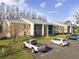 Exterior view of condo building with parking at 1433 Pine Glen Pl # D1, Tarpon Springs, FL 34688