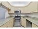 Kitchen with stainless steel appliances and granite countertops at 1433 Pine Glen Pl # D1, Tarpon Springs, FL 34688