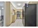 Galley kitchen with stainless steel appliances and granite counters at 1433 Pine Glen Pl # D1, Tarpon Springs, FL 34688