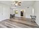 Bright living room with vinyl flooring and a ceiling fan at 1433 Pine Glen Pl # D1, Tarpon Springs, FL 34688