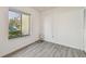 Simple office with wood-look floors and window view at 1433 Pine Glen Pl # D1, Tarpon Springs, FL 34688