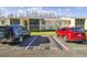 Two cars parked in assigned spots near building at 1433 Pine Glen Pl # D1, Tarpon Springs, FL 34688