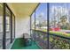 Screened-in patio overlooking parking lot at 1433 Pine Glen Pl # D1, Tarpon Springs, FL 34688