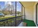 Screened patio with artificial turf and seating at 1433 Pine Glen Pl # D1, Tarpon Springs, FL 34688