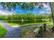 Serene pond with a fountain and walking path at 1433 Pine Glen Pl # D1, Tarpon Springs, FL 34688