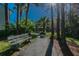 Peaceful walkway with a bench and gazebo at 1433 Pine Glen Pl # D1, Tarpon Springs, FL 34688