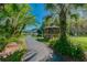 Scenic walkway leading to a gazebo near a pond at 1433 Pine Glen Pl # D1, Tarpon Springs, FL 34688