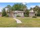 Charming ranch home with a large yard and mature landscaping at 150 Almedo Ne Way, St Petersburg, FL 33704