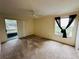 Carpeted bedroom with sliding glass doors to patio at 1568 Nantucket Ct # 1302, Palm Harbor, FL 34683