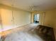 Bedroom with carpet, ceiling fan, and sliding glass doors at 1568 Nantucket Ct # 1302, Palm Harbor, FL 34683