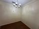 Simple dining area with laminate flooring and chandelier at 1568 Nantucket Ct # 1302, Palm Harbor, FL 34683