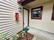 Front door entrance with landscaping at 1568 Nantucket Ct # 1302, Palm Harbor, FL 34683
