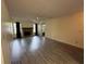 Spacious living room with fireplace and laminate flooring at 1568 Nantucket Ct # 1302, Palm Harbor, FL 34683