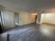 Living room with laminate flooring, sliding doors to patio at 1568 Nantucket Ct # 1302, Palm Harbor, FL 34683