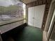Screened patio with green carpet at 1568 Nantucket Ct # 1302, Palm Harbor, FL 34683