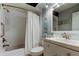Clean bathroom with a shower/tub combo, white vanity, and updated fixtures at 16115 Country Crossing Dr, Tampa, FL 33624