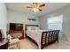 Bedroom with a ceiling fan, bed, and TV at 16115 Country Crossing Dr, Tampa, FL 33624