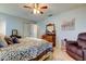 Spacious bedroom with a ceiling fan and large bed at 16115 Country Crossing Dr, Tampa, FL 33624