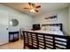 Bedroom with a ceiling fan and a full bed at 16115 Country Crossing Dr, Tampa, FL 33624