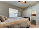 Bright bedroom with a ceiling fan and double closet at 16115 Country Crossing Dr, Tampa, FL 33624