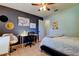 Bedroom with a ceiling fan, desk and bed at 16115 Country Crossing Dr, Tampa, FL 33624