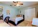 Bedroom with a ceiling fan, desk and bed at 16115 Country Crossing Dr, Tampa, FL 33624