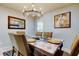 Bright dining room with table, chairs, and elegant chandelier at 16115 Country Crossing Dr, Tampa, FL 33624