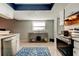 Clean kitchen with stainless steel appliances and tile floor at 16115 Country Crossing Dr, Tampa, FL 33624