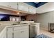 Kitchen features stainless steel appliances and white cabinets at 16115 Country Crossing Dr, Tampa, FL 33624