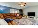 Relaxing living room with sectional sofa and large windows at 16115 Country Crossing Dr, Tampa, FL 33624