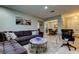 Spacious living room with comfortable seating, coffee table, and views to dining area at 16115 Country Crossing Dr, Tampa, FL 33624