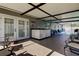 Outdoor patio with bar and seating area overlooking pool at 16115 Country Crossing Dr, Tampa, FL 33624