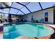 Enjoy this refreshing pool with screened enclosure and nearby patio at 16115 Country Crossing Dr, Tampa, FL 33624