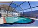 Inviting swimming pool with screened enclosure and brick coping at 16115 Country Crossing Dr, Tampa, FL 33624