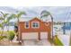 Two-story house featuring a two-car garage and waterfront access at 16134 4Th E St, Redington Beach, FL 33708