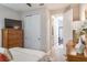Relaxing bedroom with a large TV, built-in closet and en-suite bathroom at 1815 Sunset Wind Loop # 118, Oldsmar, FL 34677
